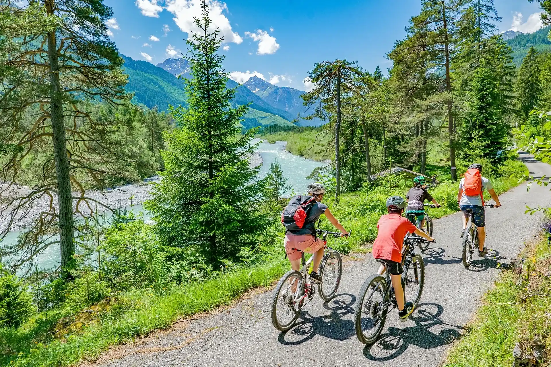 Family cycling along the Lech river