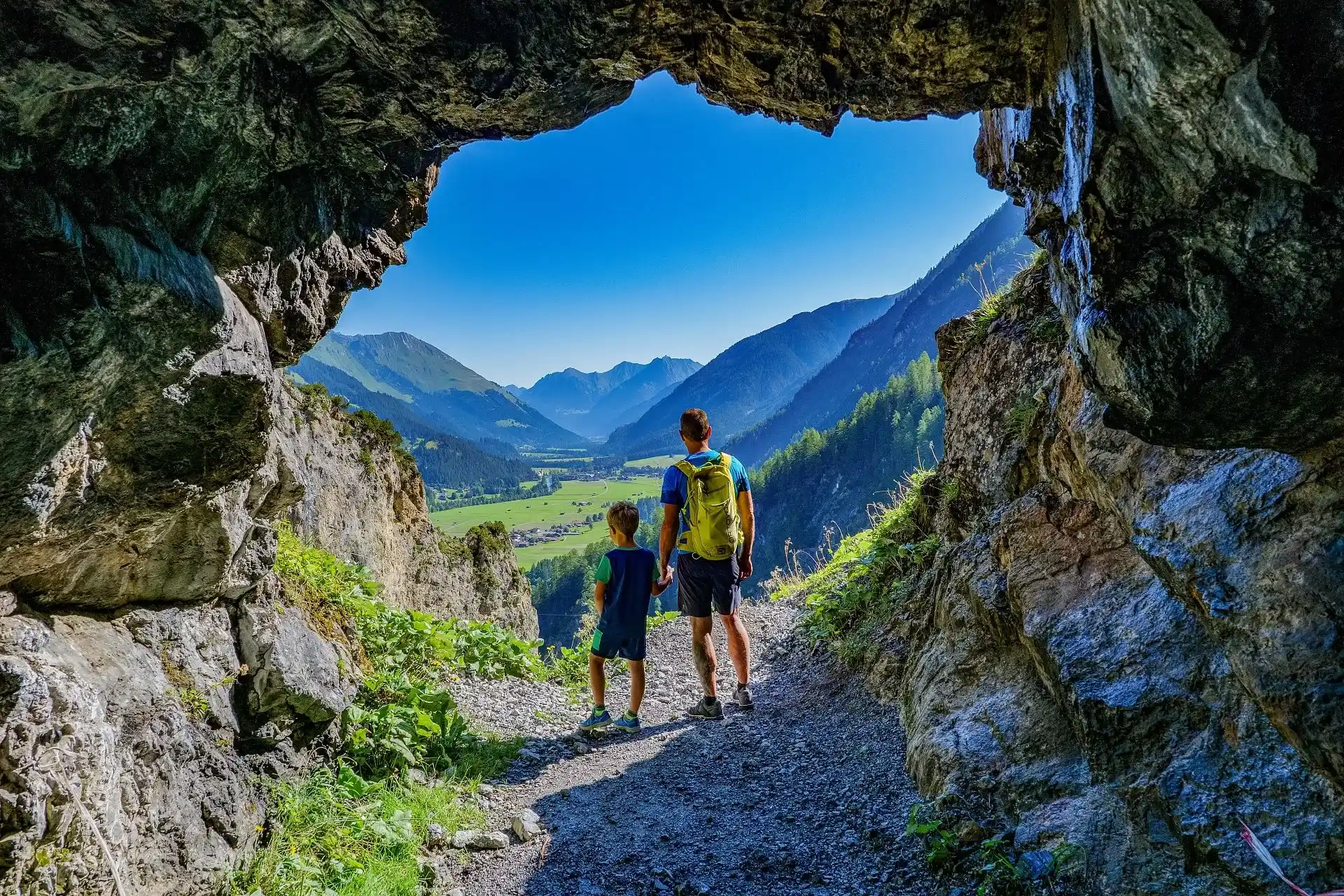 Father and child enjoying the view over the Lechtal on a hike
